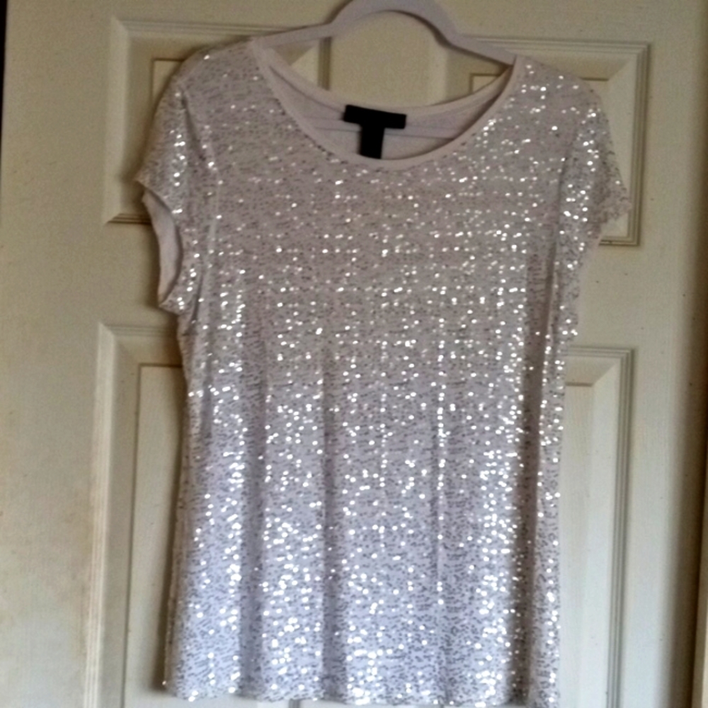 White sequin blouse.